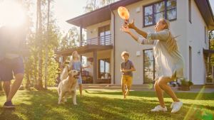 Family playing in backyard